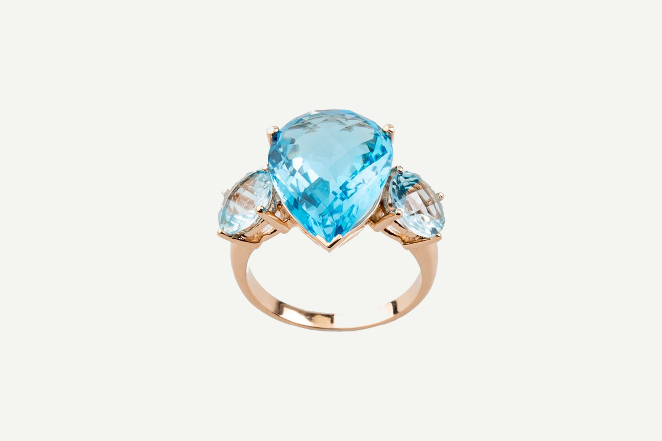 Anillo Setenta y Nueve en oro rosa con topacio azul Swiss y topacio azul Sky