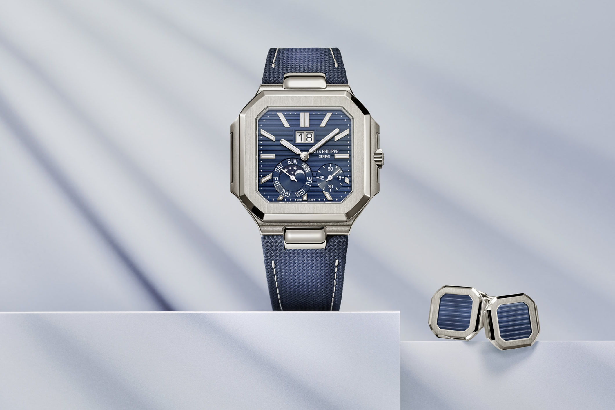 Patek Philippe Cubitus watch, reference 5822P-001 with a platinum case, square sunburst blue dial and a navy blue composite fabric strap