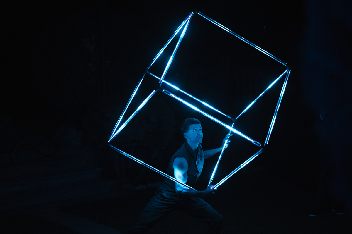 An artist performing a light-juggling show for guests in the Finca Son Togores gardens during the Patek Philippe presentation