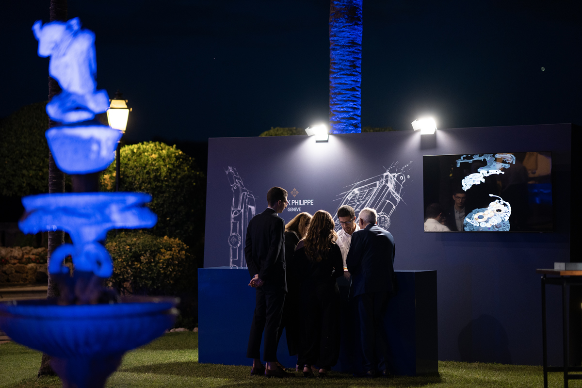 Night view of the gardens and facade of Finca Son Togores, illuminated in a blue light for the Patek Philippe Cubitus presentation